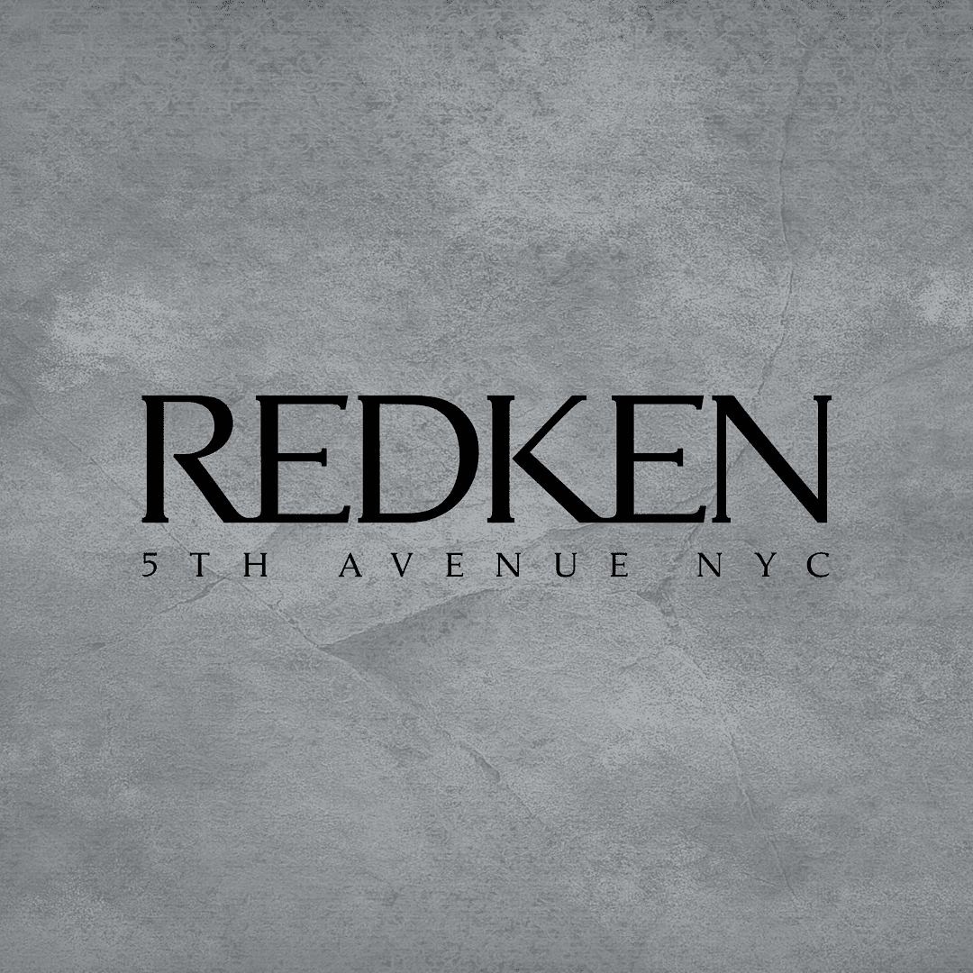 Redken 5th Avenue NYC logo on a textured gray background.